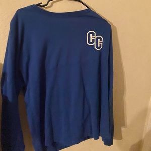 It’s a long sleeve blue shirt.